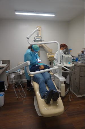 A person during their dental checkup.