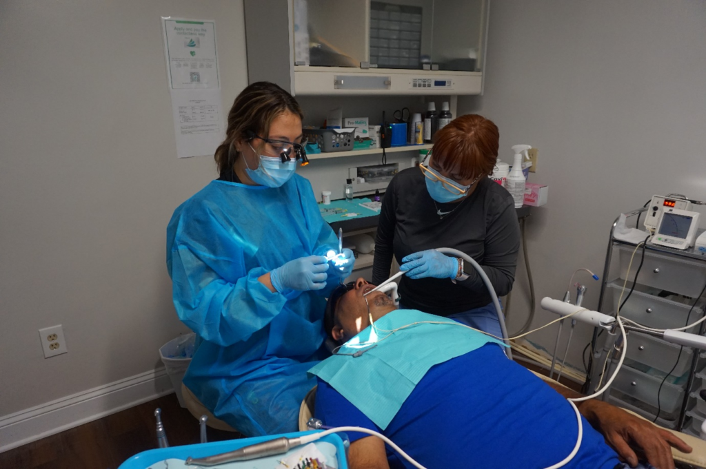 A person is undergoing a dental procedure.