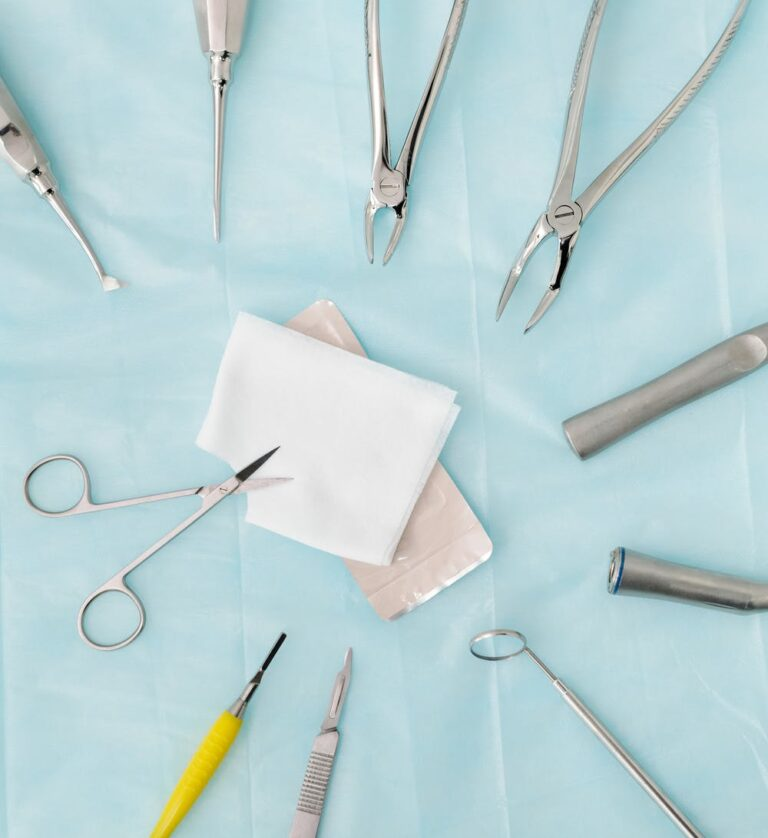 Different dental tools on a blue sheet